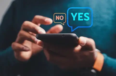 person using smartphone with no and yes options popping up